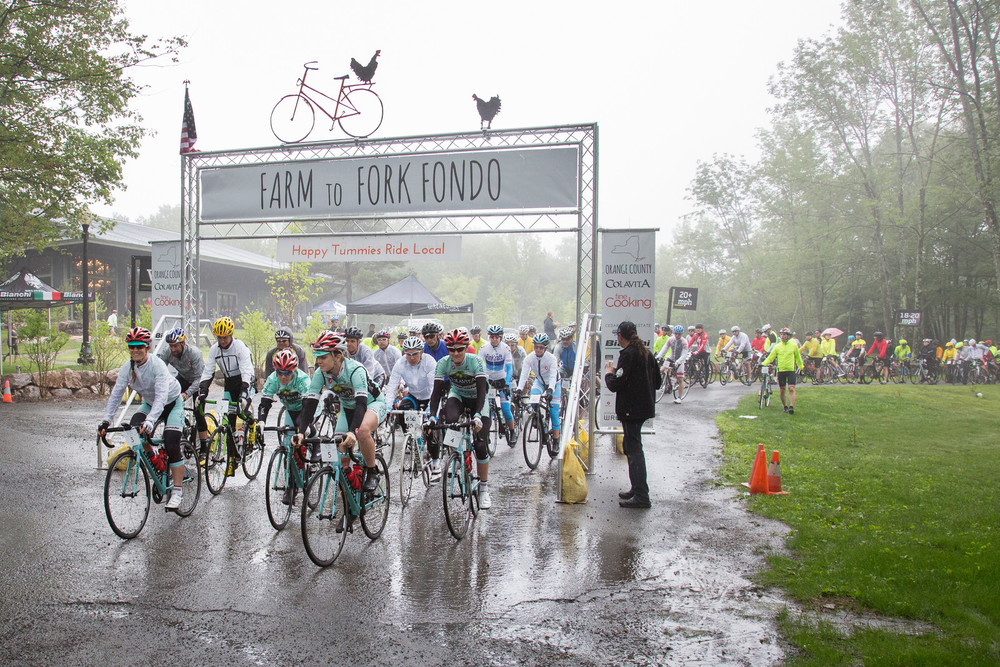 "Hundreds of cyclists start off on the Farm to Fork Fondo ridng tour in heavy rain at Cedar Lakes Estate in Greenville at 9:15 AM Sunday morning June 28, 2015"